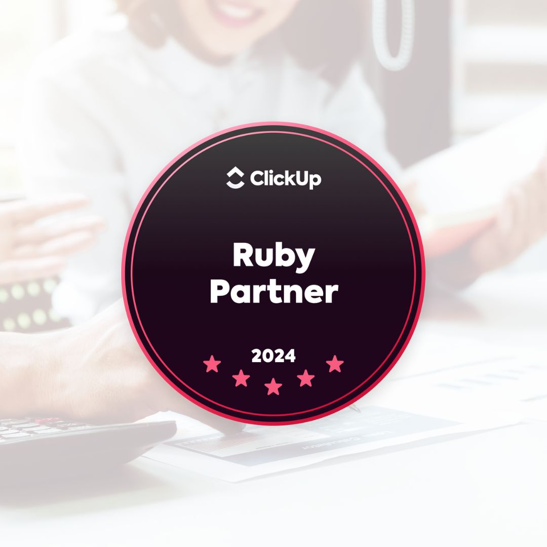 A photo of someone putting sticky notes on a table overlayed with the ClickUp 2023 Ruby Partner badge. 