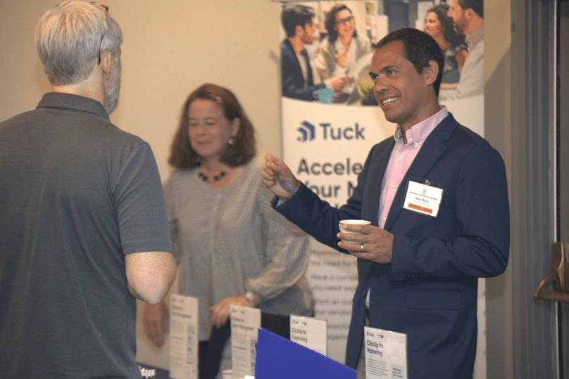 Alex, Amy, and a visitor at the Tuck Sponsor Table at the Vermont Nonprofit Summit